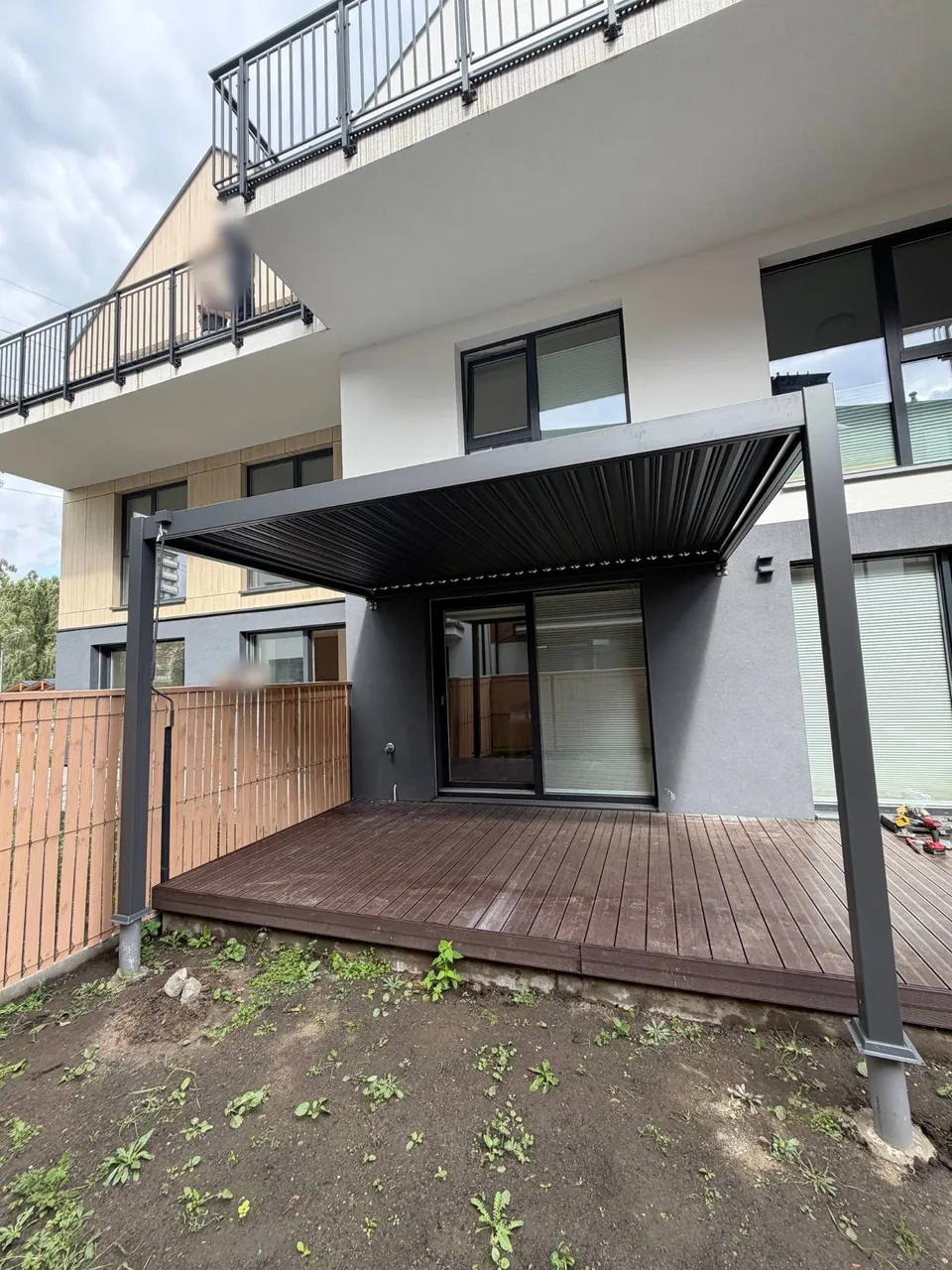 Aluminium pergola by the terrace, seen from the garden
